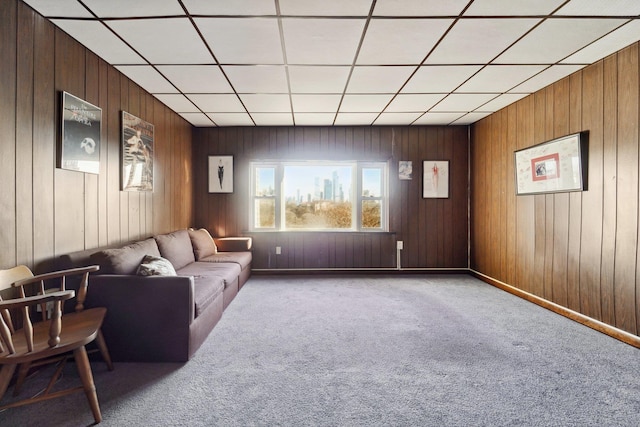 unfurnished living room with wood walls and carpet flooring