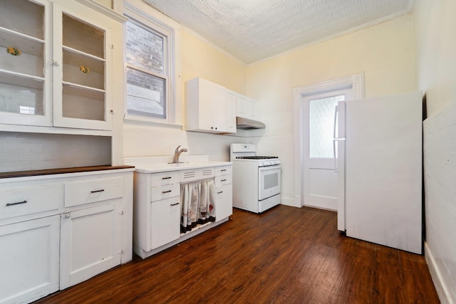 kitchen featuring sink, white cabinetry, white appliances, and dark wood-type flooring