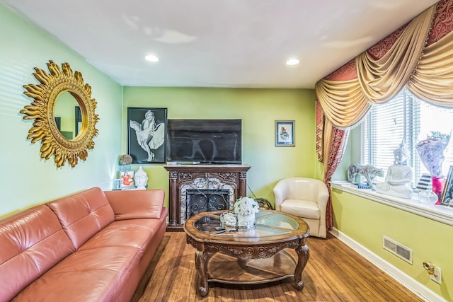 12 Streuli Ct, Elmwood Park, NJ 07407 - living area with baseboards, wood finished floors, a fireplace, and recessed lighting