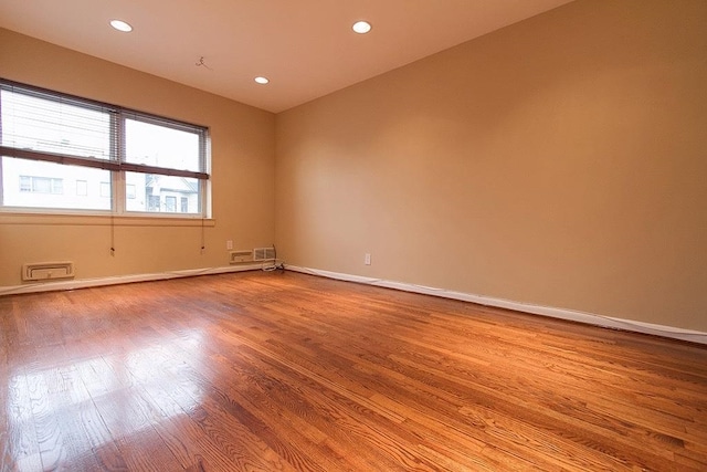 spare room featuring light wood-type flooring