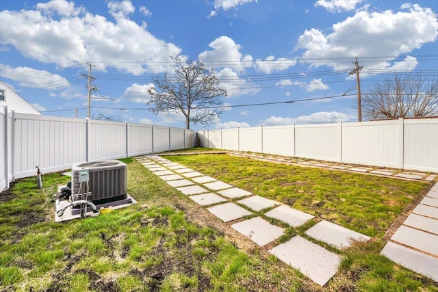 view of yard featuring central air condition unit