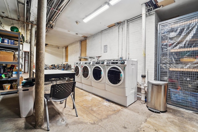 shared laundry area featuring washing machine and dryer