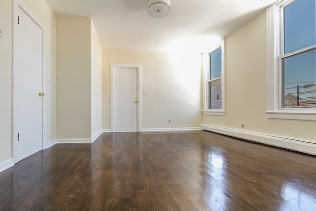 148 S St, Jersey City, NJ 07307 - spare room featuring wood finished floors and a baseboard radiator