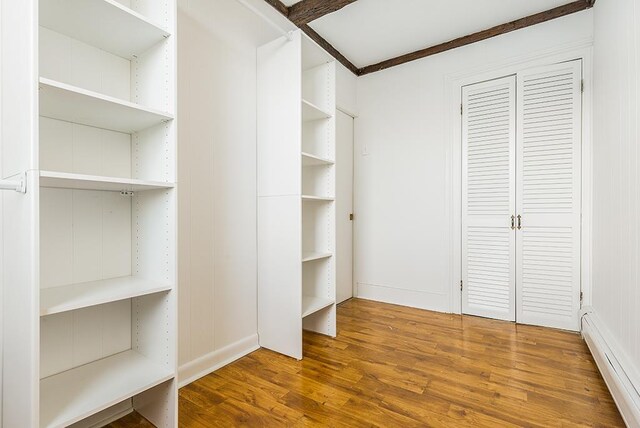 148 S St, Jersey City, NJ 07307 - walk in closet with baseboard heating and wood finished floors