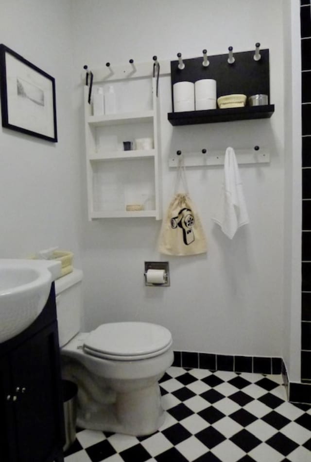 bathroom with tile patterned floors, toilet, and vanity