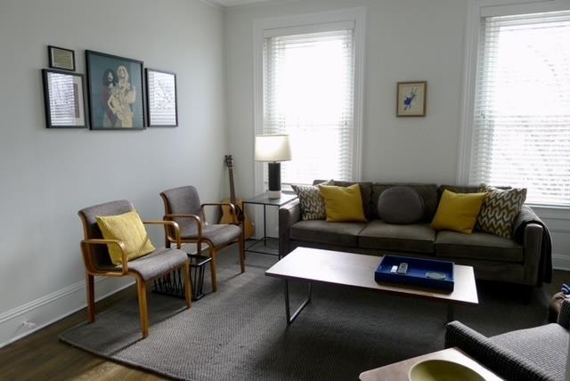 living room with wood finished floors and baseboards