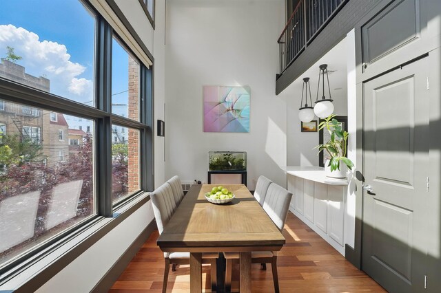 245 Ogden Ave Unit 2, Jersey City, NJ 07307 - dining space with a towering ceiling and wood finished floors