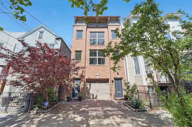 245 Ogden Ave Unit 2, Jersey City, NJ 07307 - view of property featuring brick siding, driveway, and fence
