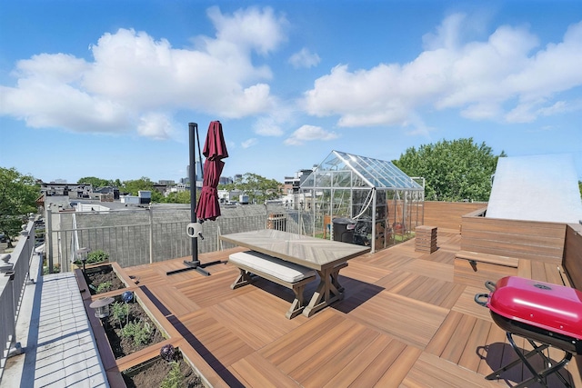 245 Ogden Ave Unit 2, Jersey City, NJ 07307 - wooden deck featuring outdoor dining space, grilling area, and a greenhouse