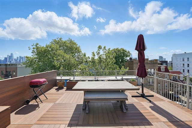 245 Ogden Ave Unit 2, Jersey City, NJ 07307 - wooden deck with area for grilling and a view of skyline