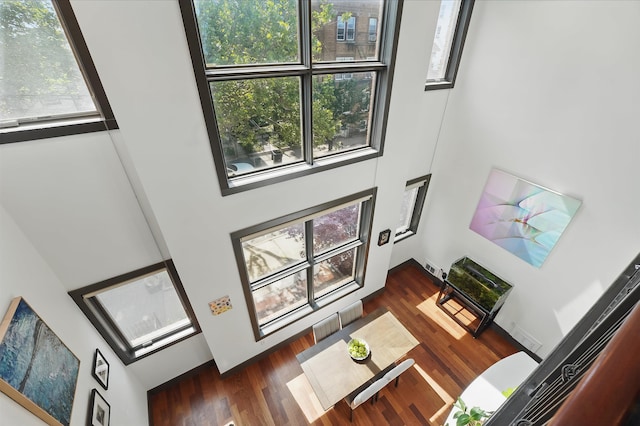 245 Ogden Ave Unit 2, Jersey City, NJ 07307 - living room with a towering ceiling and dark wood-style flooring