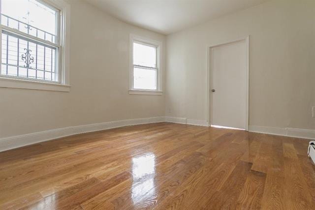 198 Myrtle Ave, Jersey City, NJ 07305 - empty room with wood finished floors