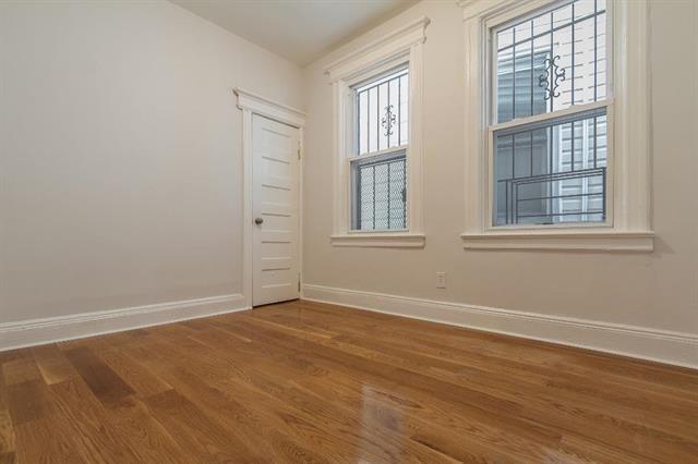198 Myrtle Ave, Jersey City, NJ 07305 - unfurnished room with baseboards and wood finished floors