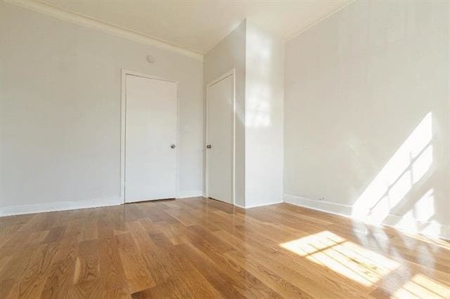 198 Myrtle Ave, Jersey City, NJ 07305 - spare room with wood finished floors and crown molding