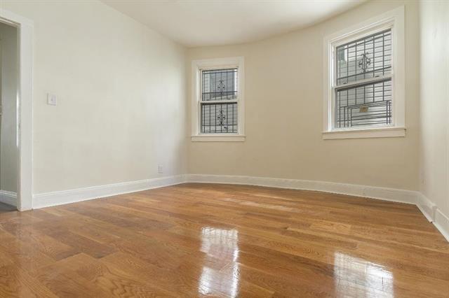 198 Myrtle Ave, Jersey City, NJ 07305 - unfurnished room featuring baseboards and wood finished floors