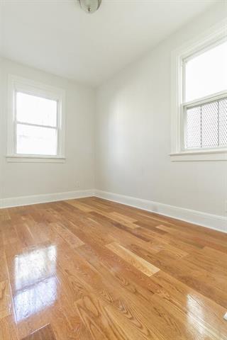 198 Myrtle Ave, Jersey City, NJ 07305 - spare room featuring light wood-type flooring and baseboards
