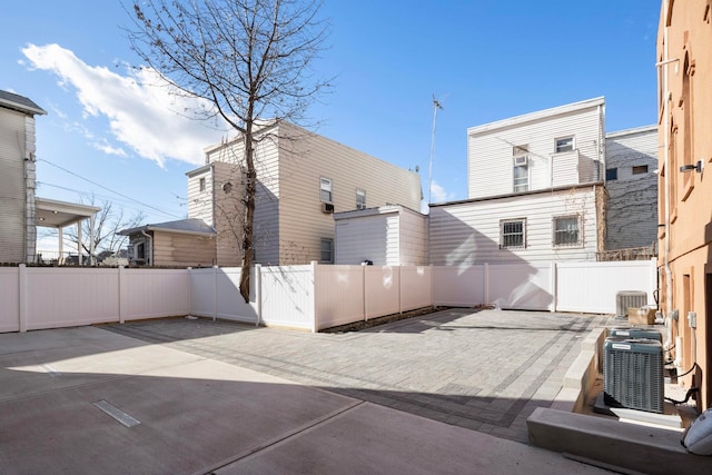 back of house featuring cooling unit and a patio area