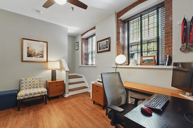 home office featuring wood finished floors and ceiling fan