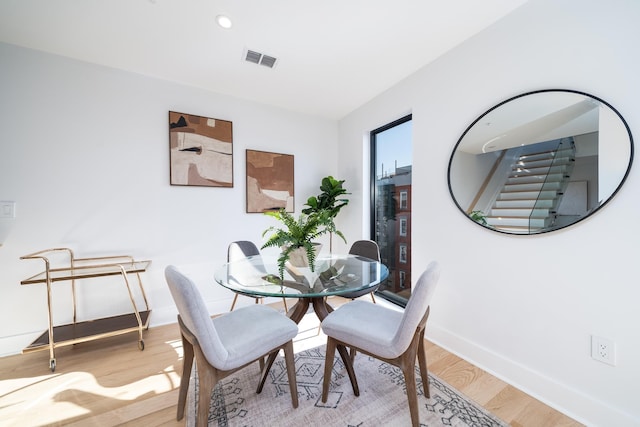 dining area with light hardwood / wood-style flooring