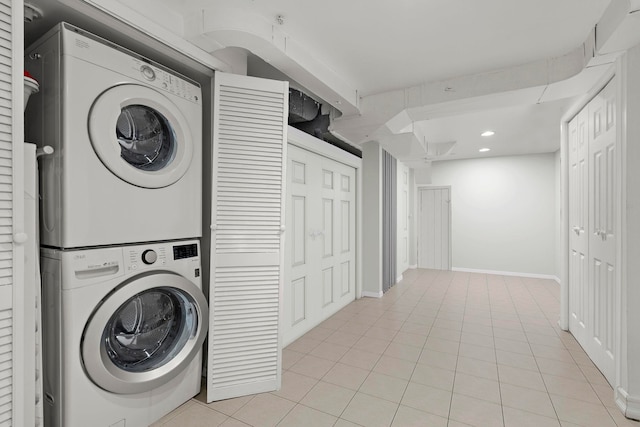 5 Bonn Pl, Weehawken, NJ 07086 - washroom featuring stacked washer and clothes dryer, light tile patterned floors, and recessed lighting