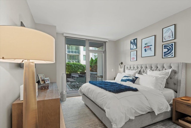 9 Avenue At Port Imperial Unit 313, West New York, NJ 07093 - bedroom featuring access to outside and wood finished floors
