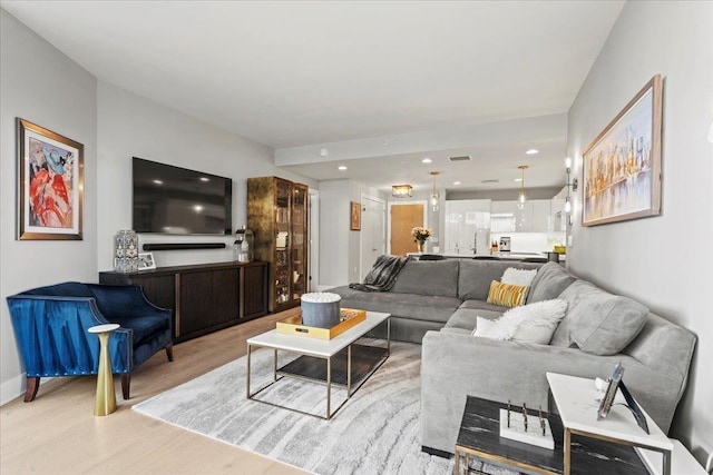 9 Avenue At Port Imperial Unit 313, West New York, NJ 07093 - living room featuring wood finished floors and recessed lighting