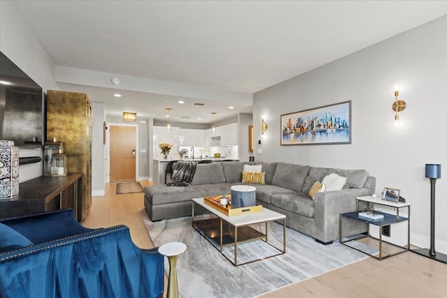 9 Avenue At Port Imperial Unit 313, West New York, NJ 07093 - living area with light wood-type flooring, baseboards, and recessed lighting