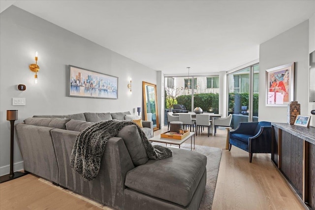9 Avenue At Port Imperial Unit 313, West New York, NJ 07093 - living room with light wood-style flooring and expansive windows