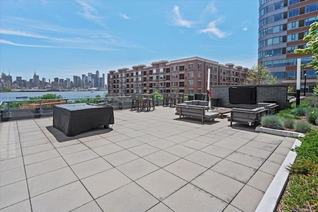 9 Avenue At Port Imperial Unit 313, West New York, NJ 07093 - view of patio / terrace with a view of skyline, an outdoor hangout area, and a water view
