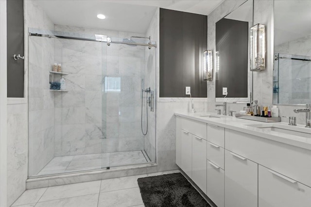 9 Avenue At Port Imperial Unit 313, West New York, NJ 07093 - bathroom with a shower stall, double vanity, tile walls, and recessed lighting