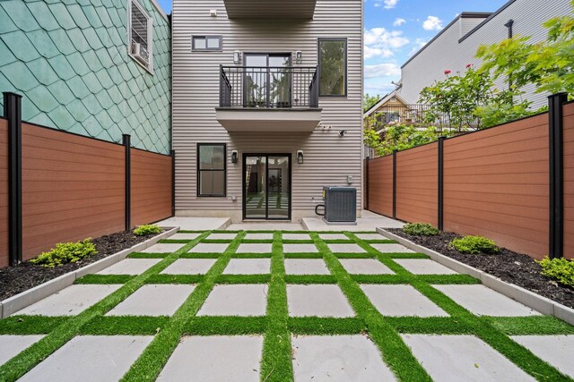 248 New York Ave Unit 1, Jersey City, NJ 07307 - fenced backyard with a balcony, a patio, and central AC