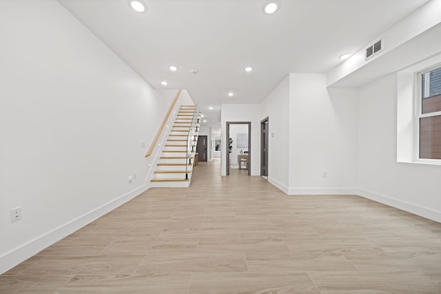 248 New York Ave Unit 1, Jersey City, NJ 07307 - empty room featuring recessed lighting, stairs, and baseboards