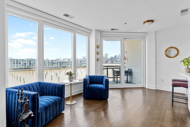 600 Harbor Blvd Unit 903, Weehawken, NJ 07086 - living area with wood finished floors, a water view, and baseboards
