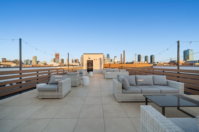 view of patio / terrace with outdoor lounge area and a city view