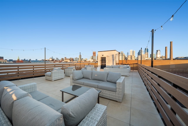 view of patio / terrace featuring an outdoor living space and a city view