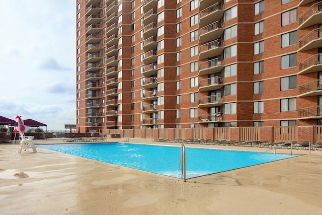 view of swimming pool featuring a patio