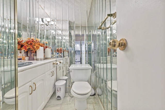 bathroom with toilet and a chandelier