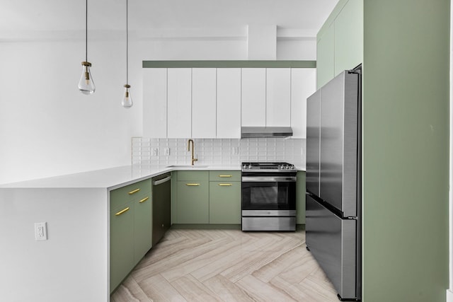 322 3rd St Unit 1, Jersey City, NJ 07302 - kitchen featuring stainless steel appliances, under cabinet range hood, green cabinetry, decorative backsplash, and light countertops