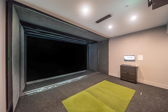 playroom with dark colored carpet and golf simulator