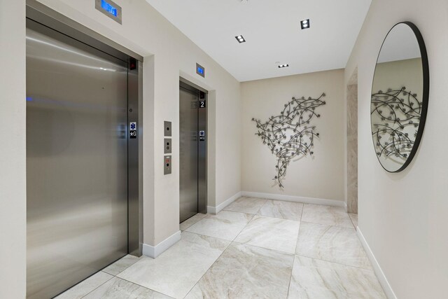 43 Provost St Unit 10O, Jersey City, NJ 07302 - hallway featuring elevator and baseboards
