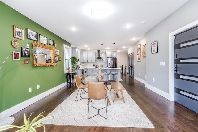 dining space featuring dark hardwood / wood-style floors