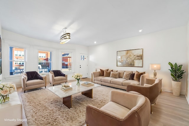 living room with light hardwood / wood-style flooring