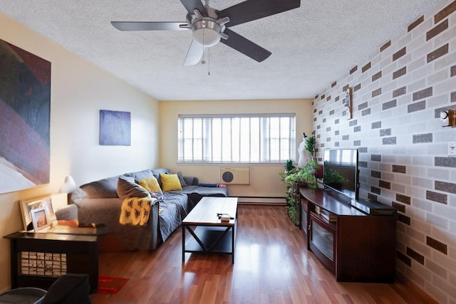 living room featuring dark wood-style floors, a textured ceiling, a baseboard radiator, and a ceiling fan