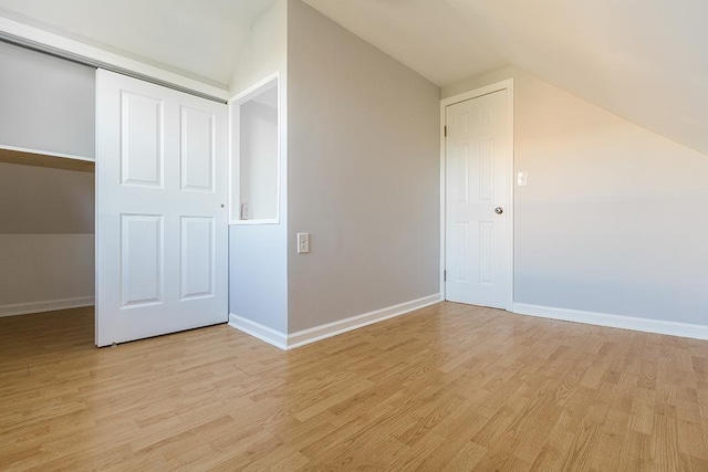 33 W 24th St, Bayonne, NJ 07002 - bonus room with lofted ceiling, light wood-type flooring, and baseboards