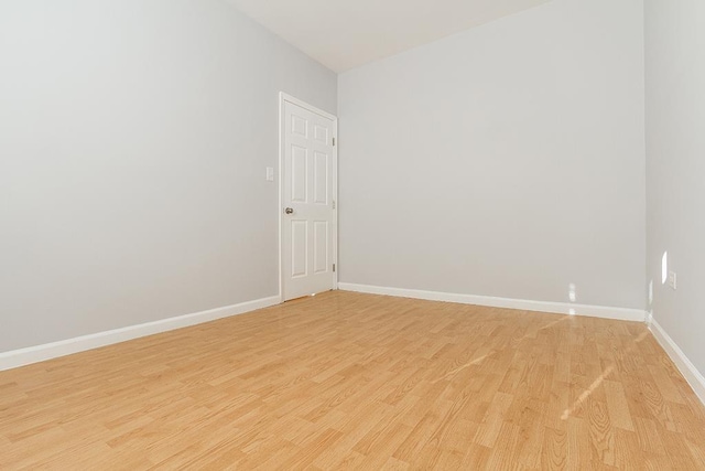 33 W 24th St, Bayonne, NJ 07002 - empty room featuring light wood-style floors and baseboards