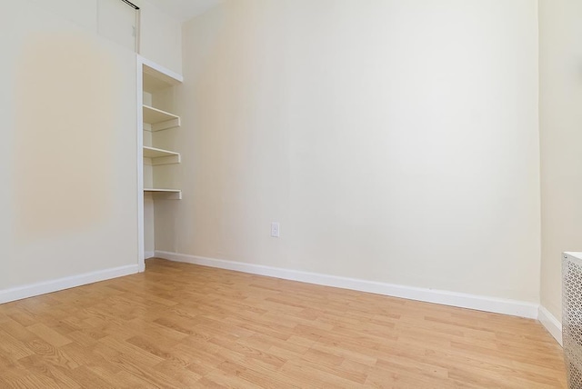 33 W 24th St, Bayonne, NJ 07002 - empty room with light wood-type flooring and baseboards