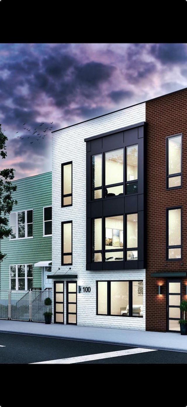 exterior space featuring brick siding