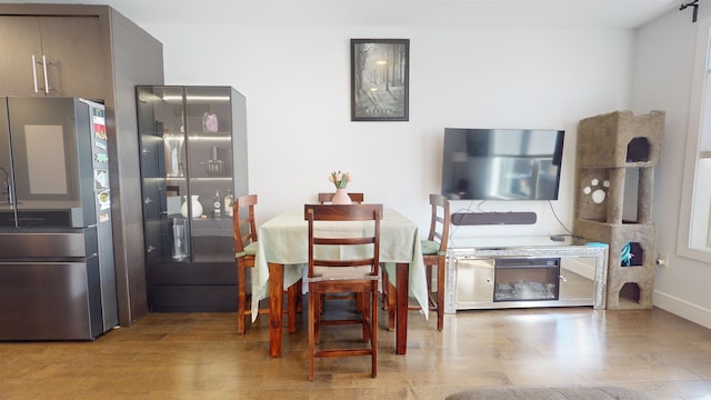 dining space featuring light wood-type flooring