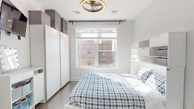 bedroom with light hardwood / wood-style floors