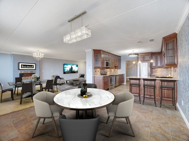 250 Gorge Rd Unit 16D, Cliffside Park, NJ 07010 - dining room with a chandelier, stone finish flooring, and ornamental molding